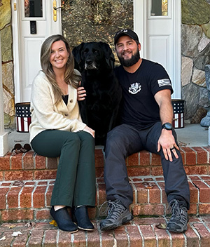 Alumni of the Month - Nick Nichols with his wife and dog