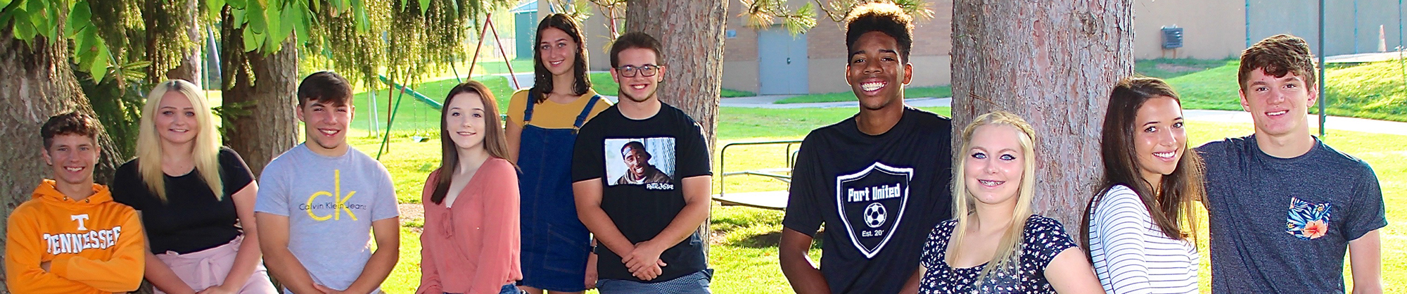 group of high school students standing together outside