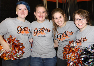 four girls wearing t-shirts that say Gators