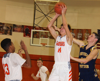 boys basketball player taking a shot