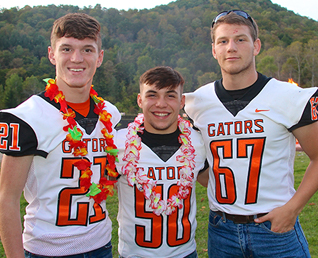 three football players in jerseys